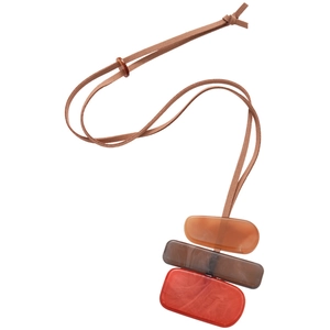 Bohemian long necklace featuring red and brown resin pendants on a light brown wax cord