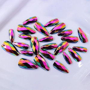 Detail of 3D geometric laser cut almond press-on nails with rainbow metallic chrome finish