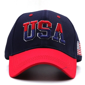 Close-up of USA 3D embroidery and flag patch on navy blue cotton baseball cap