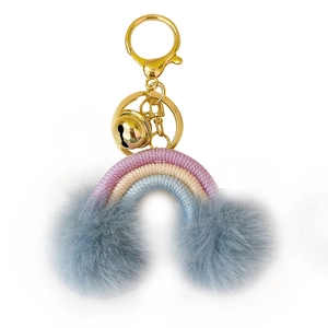 Handmade woven rainbow keychain with fluffy grey pom poms and golden metal hardware