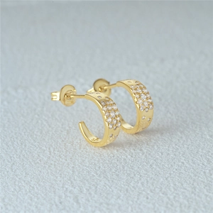 Close-up of S925 sterling silver hallmark on gold-plated star hoop earrings