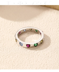 Macro shot of S925 sterling silver ring with colorful heart-shaped cubic zirconia stones