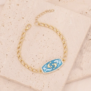 Gold-plated Pisces zodiac bracelet with blue enamel charm and sparkling zircon stones
