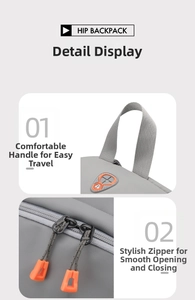 Detail of grey waterproof nylon backpack featuring a sturdy handle and vibrant orange zippers