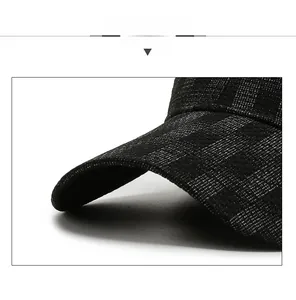 Close-up of the black baseball cap showing detailed woven texture and sturdy stitching