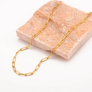 Detail of 18k gold plated stainless steel paperclip chain on a natural raw gemstone