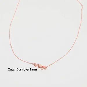 Macro shot of rose gold necklace chain detail with 1mm outer diameter measurement