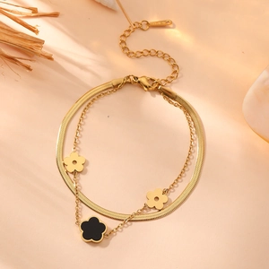 Double-layered stainless steel clover bracelet with black and gold floral pendants