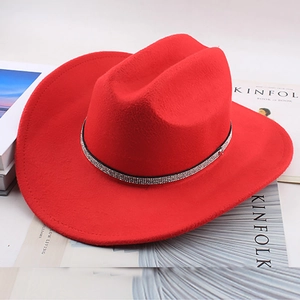Detail of red western cowboy hat with sparkling rhinestone band on Kinfolk magazines