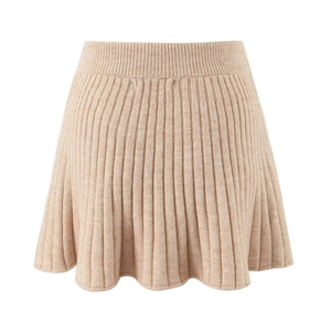 Detailed view of apricot ribbed knit mini skirt with elastic waistband on white background