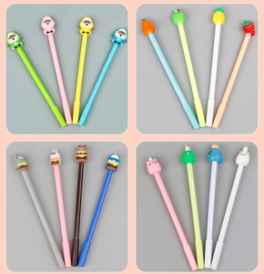 Detailed close-up of student gel pens with colorful silicone cartoon fruit toppers