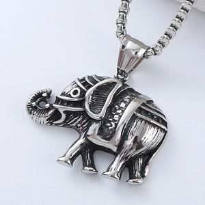 Macro detail of vintage silver elephant skull pendant with intricate retro textures