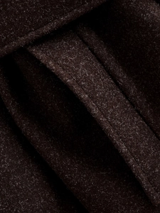 Macro detail of dark brown wool coat fabric texture and premium stitching quality