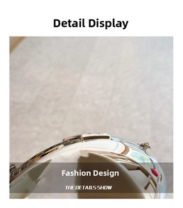 Detailed macro shot of the high-gloss metallic latch and hinge on an acrylic clutch bag