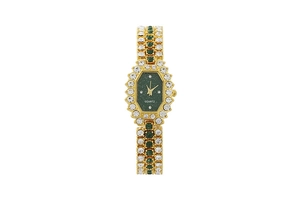 Detailed view of luxury gold watch with green dial and sparkling crystal embellishments