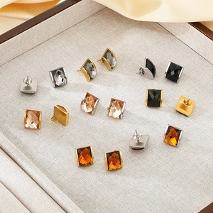 Macro view of multi-color square faceted glass earrings with 18K gold-plated bases