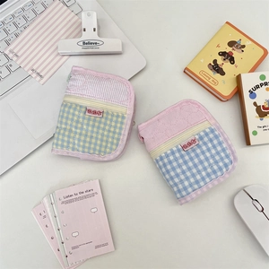 Quilted fabric binder covers with heart stitching and zipper in pink plaid design