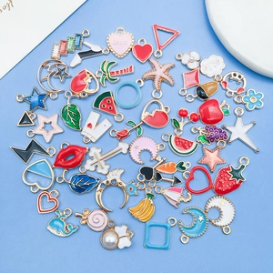 Colorful enamel charms set featuring moon star fruit and heart shapes for DIY jewelry making