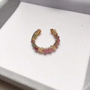 Macro shot of 14K gold-filled wire wrapped ring with colorful tourmaline beads