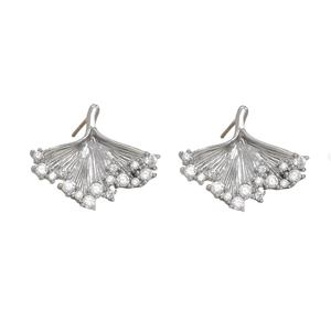 Detail of silver ginkgo leaf stud earrings with sparkling inlaid stones on white background
