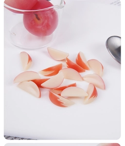 Macro view of realistic 2cm artificial apple slices for dollhouse food accessories