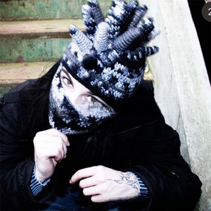 Detailed knit texture of punk balaclava with unique black and white horned decorations