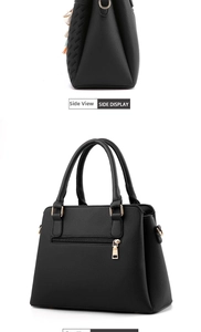 Side and back view of a black pebbled leather handbag with colorful tassel and gold hardware