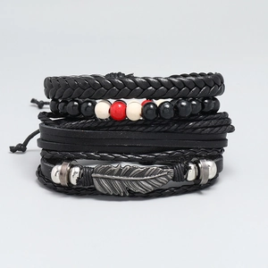 Set of 4 vintage layered leather bracelets with woven straps and metal feather charm