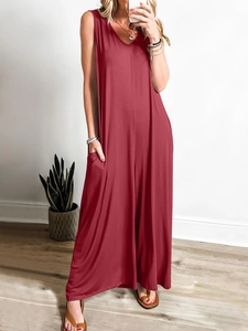 Close-up of sleeveless burgundy jumpsuit showing fabric texture and side pocket detail