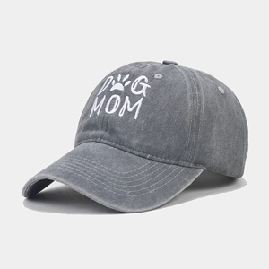 Close-up of DOG MOM embroidery on dark grey washed cotton baseball cap with curved brim