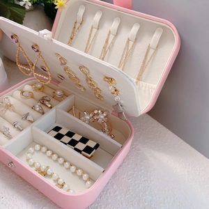 Pink leather jewelry organizer box with multi-layer storage for necklaces and rings