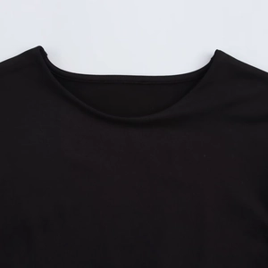Detail shot of black long sleeve bodysuit neckline showing ribbed knit texture fabric