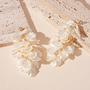 Elegant white acrylic petal tassel earrings with gold studs and crystal accents