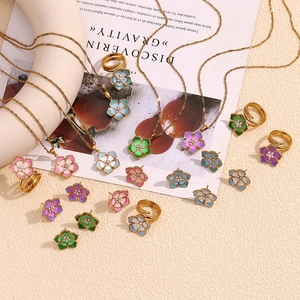 Detailed set of floral enamel necklaces, rings and earrings with 18K gold plating