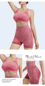 Detail view of marled red high waist yoga shorts and sports bra with breathable mesh side