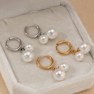 Elegant gold and silver stainless steel earrings with double pearl drops in jewelry box