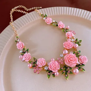 Elegant floral necklace with pink resin roses, pearls and crystals on gold chain