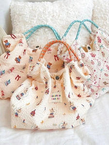 Cute seersucker canvas bags with cartoon patterns and woven rope handles for beach travel