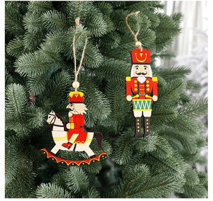 Classic wooden nutcracker and rocking horse soldier ornaments on a green Christmas tree
