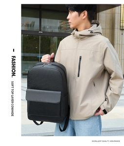 Detail of high-quality soft top layer cowhide texture on a black business travel backpack