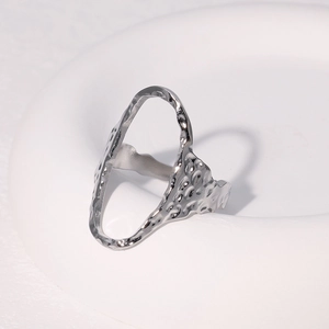 Minimalist silver oval open ring with hammered texture finish for women on white tray