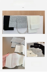 Detail of ribbed knit calf socks in white, gray, and black colors with lightweight texture