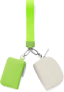 Detail view of neon green wristlet strap with cream circular and neon green rectangular pouch