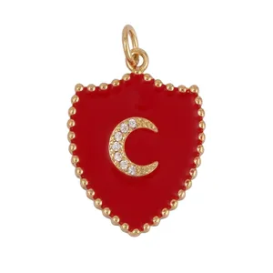 Detail view showing dimensions of shield pendant with red oil drip and moon zircon