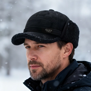 Men's winter aviator trapper hat with thick fleece lining and ear flaps in snowy outdoor scene