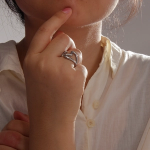 Minimalist silver hollow heart open ring in stainless steel for women on index finger