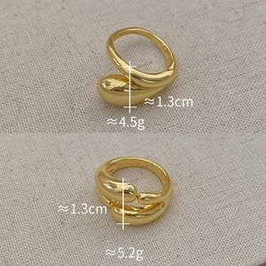 Detailed view of dual-layer gold plated teardrop rings with weight and size parameters