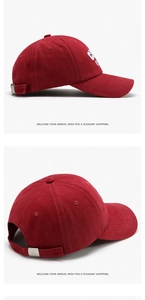 Detail view of burgundy baseball cap featuring premium 3D embroidery and metal buckle strap