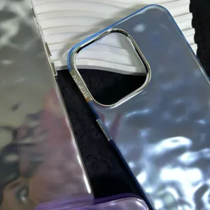 Detail of blue water ripple phone case featuring metallic camera ring and clear textures