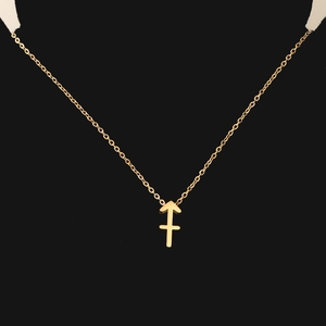 Macro shot of gold constellation necklace with Sagittarius arrow pendant on black background